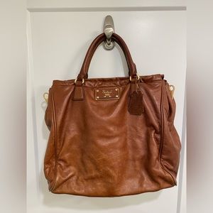 Brown leather purse. Cross body or hand held.